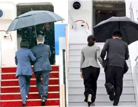 韩国总统夫人雨中撑伞